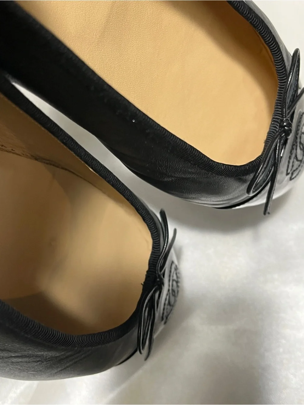 CHANEL Black Leather Ballet Flats with Patent Cap Toe & CC Motif